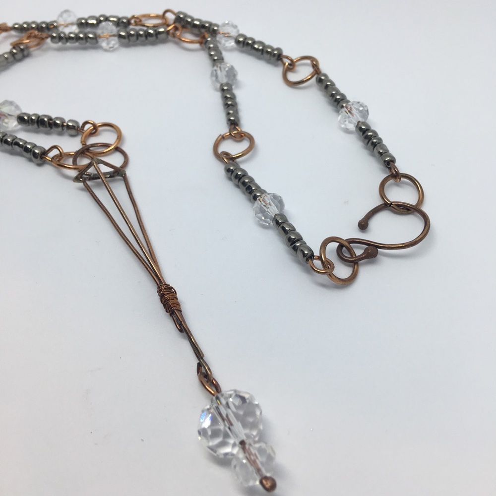 Handmade bronze geometric & hand beaded necklace.