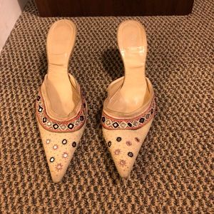 Beautiful brightly accentuated Versace nude heels.