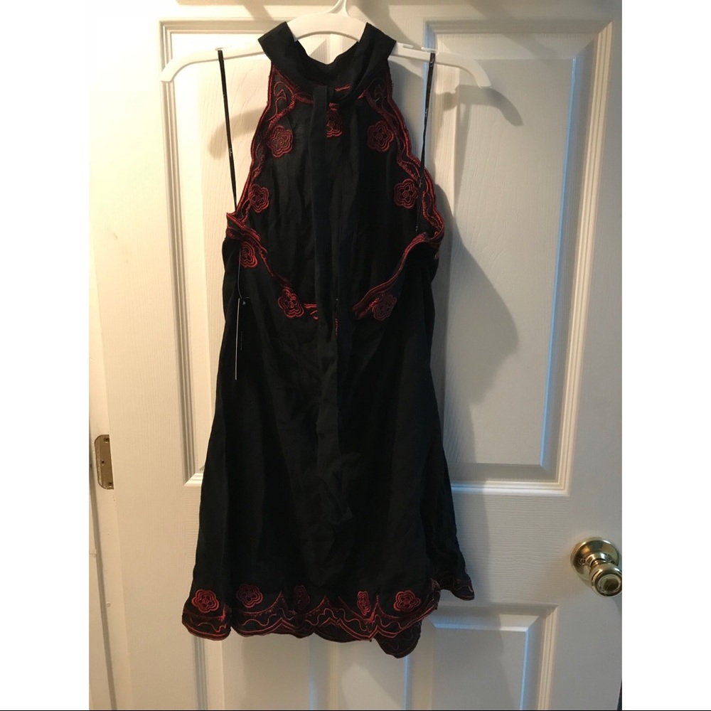 Black mini halter dress with red detail