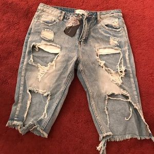 denim: shredded Bermuda style shorts
