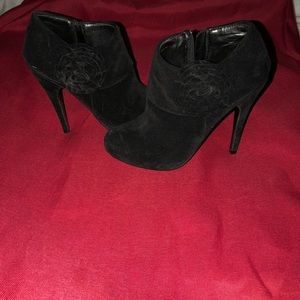 Black sway heeled booties