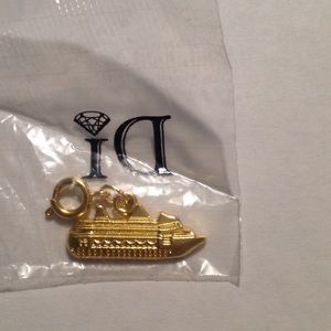 Gold colored cruise ship charm