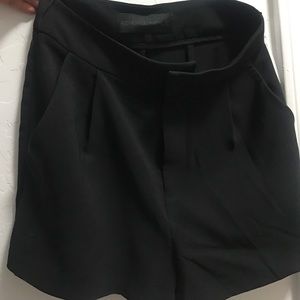 Kendall + Kylie black shorts.