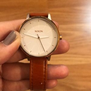 Leather/gold Nixon watch.