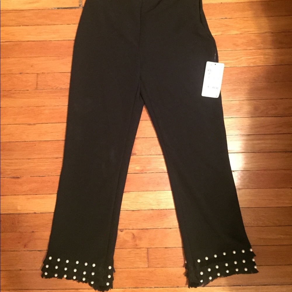 Ankle length pants with pearls.
