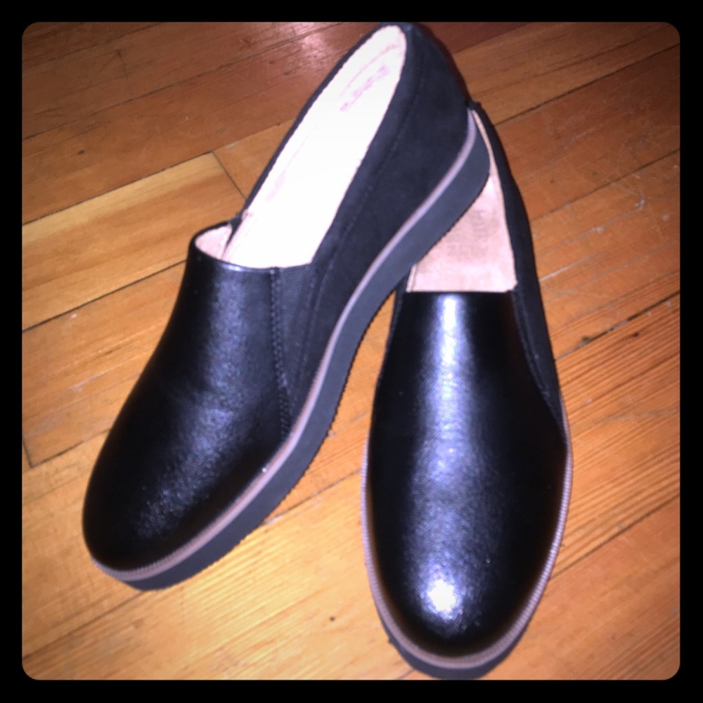 Black leather slip ons
