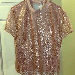 Short sleeved sequined shirt.