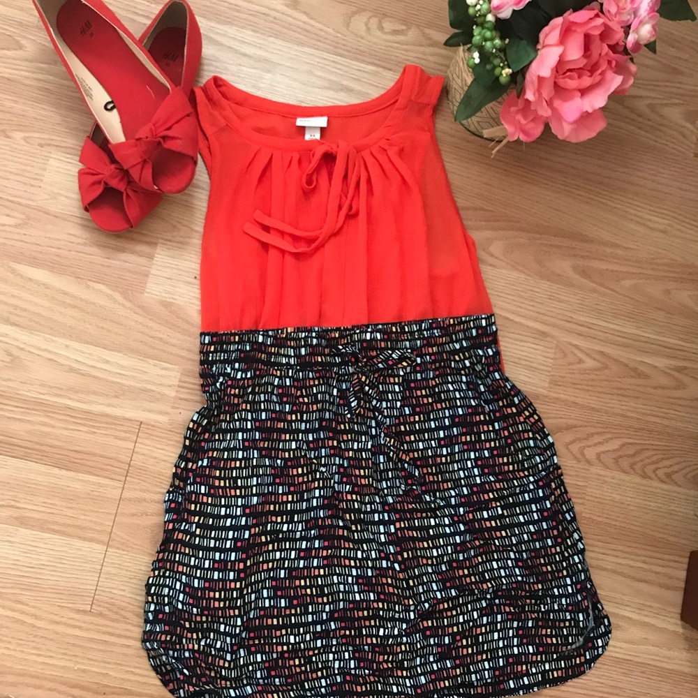 Red blouse with abstract skirt