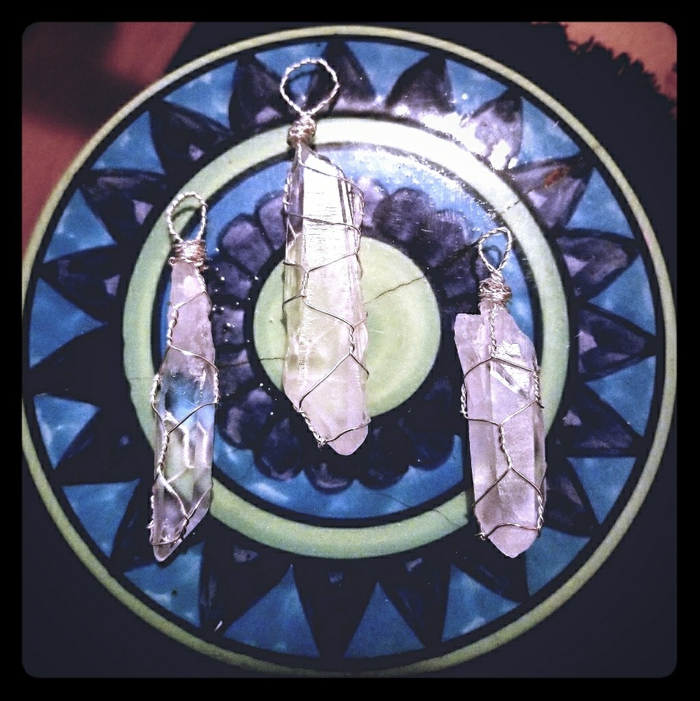 Sterling silver wrapped clear quartz pendants