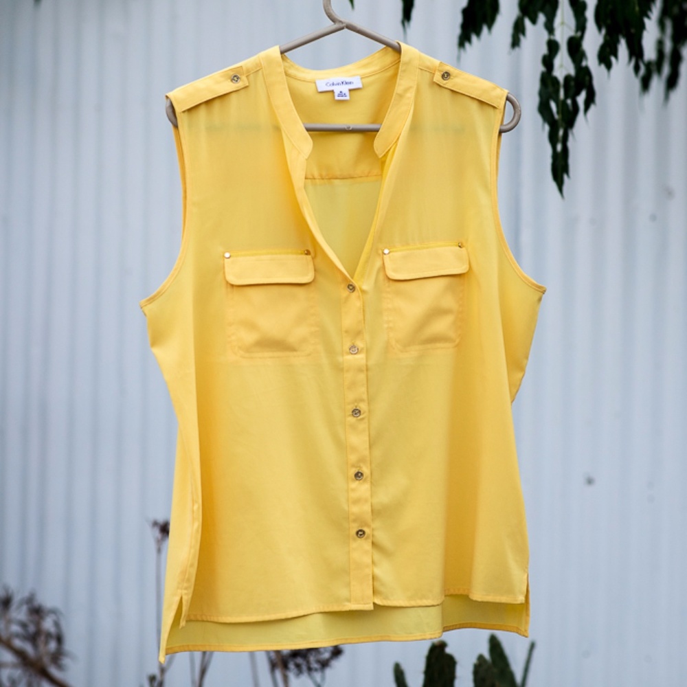 Yellow sleeveless blouse