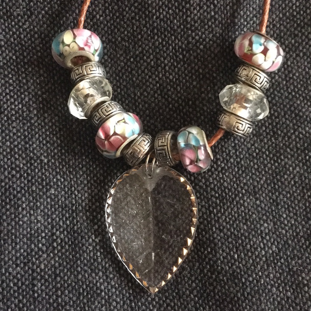 Beautiful necklace on a brown leather cord