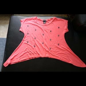 Pink crop top with dark grey skulls