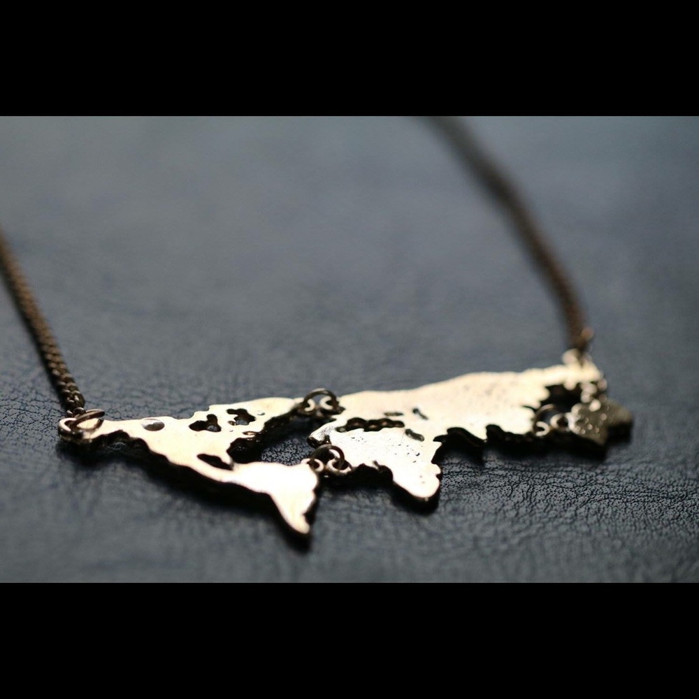 Gold world map necklace