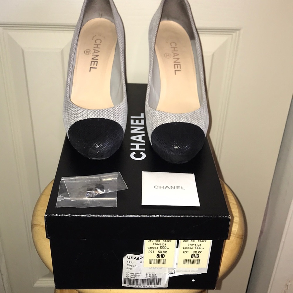 New heel taps Chanel Silver and Black Captoe pumps