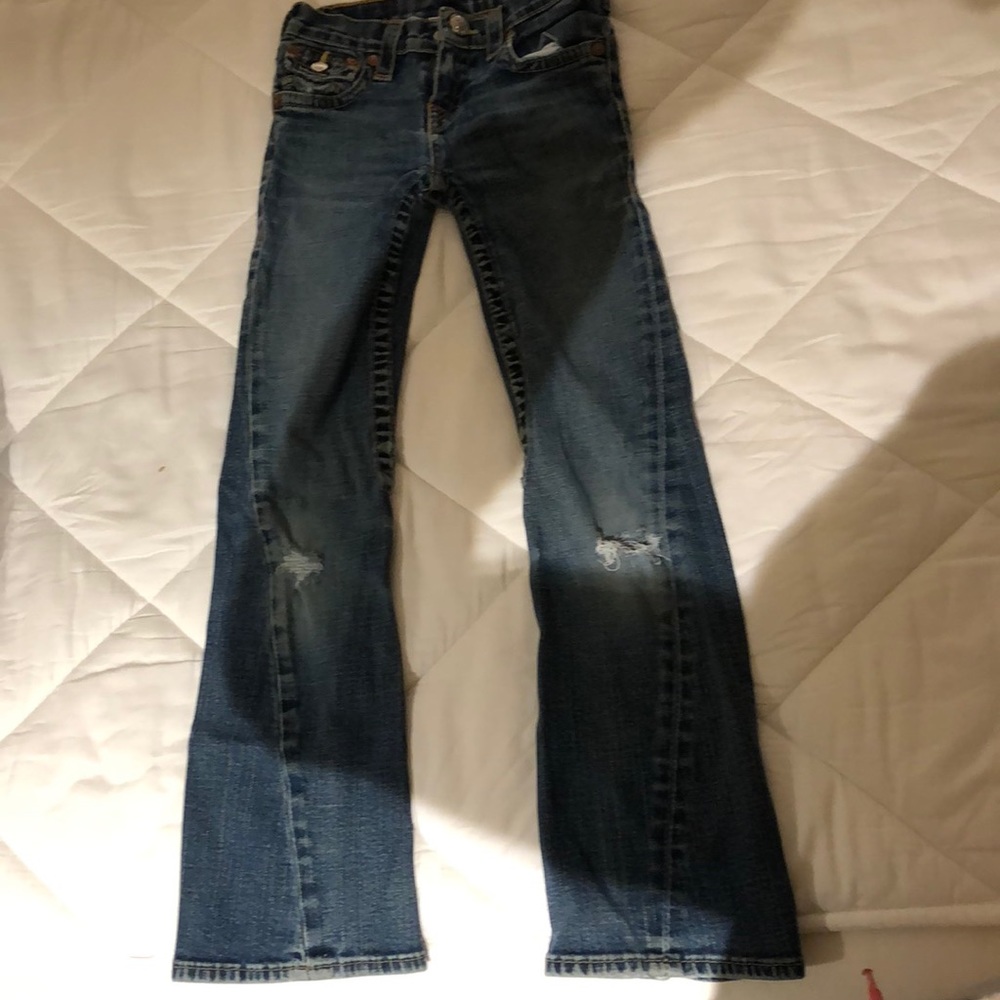 Girls True Religion jeans.