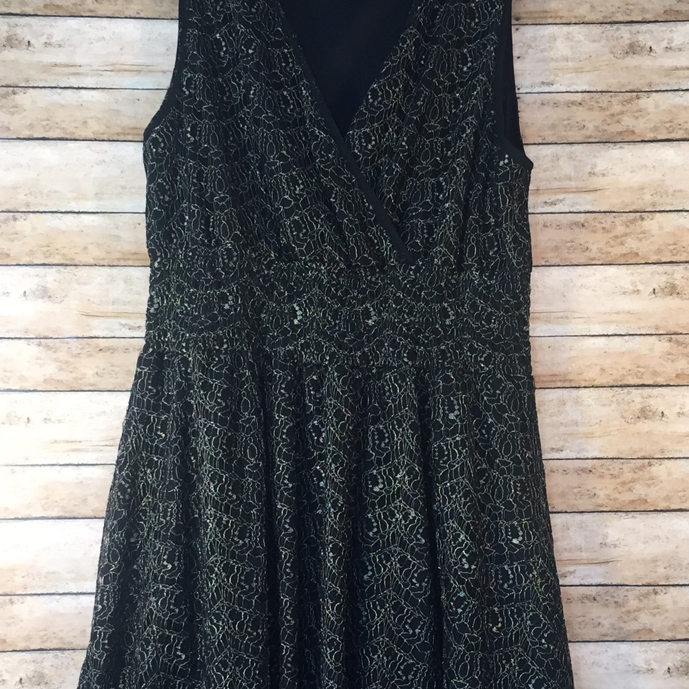 Gorgeous black background with gold lace dress