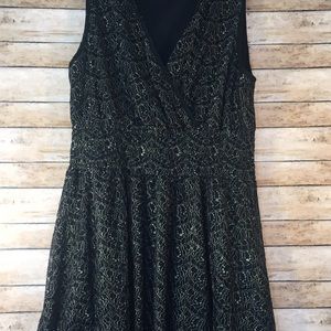 Gorgeous black background with gold lace dress