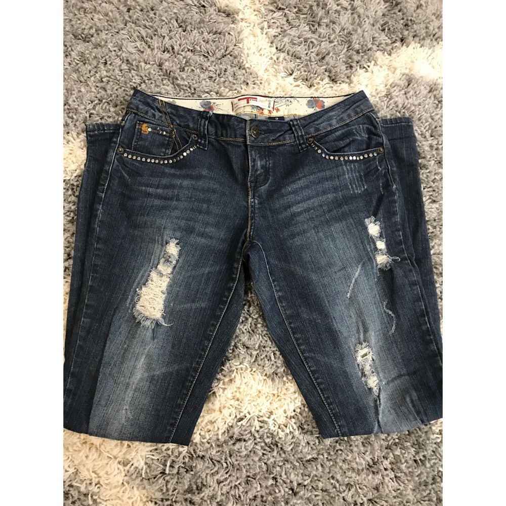Distressed and embellished skinny jeans