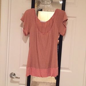 Blush-peach knit top.