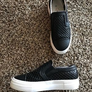 Black platform sneakers.
