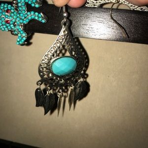Silver and turquoise feather earrings.