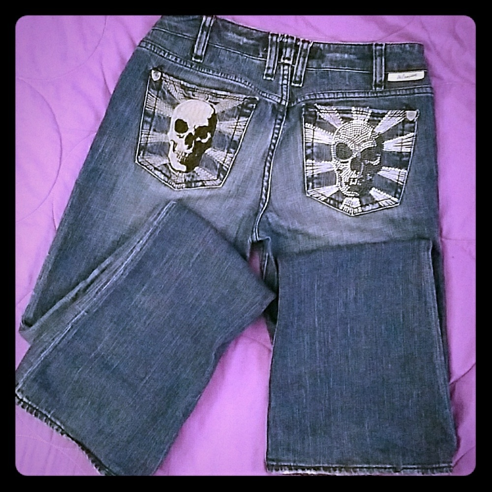 Semi-flare jeans with skulls on back pockets.