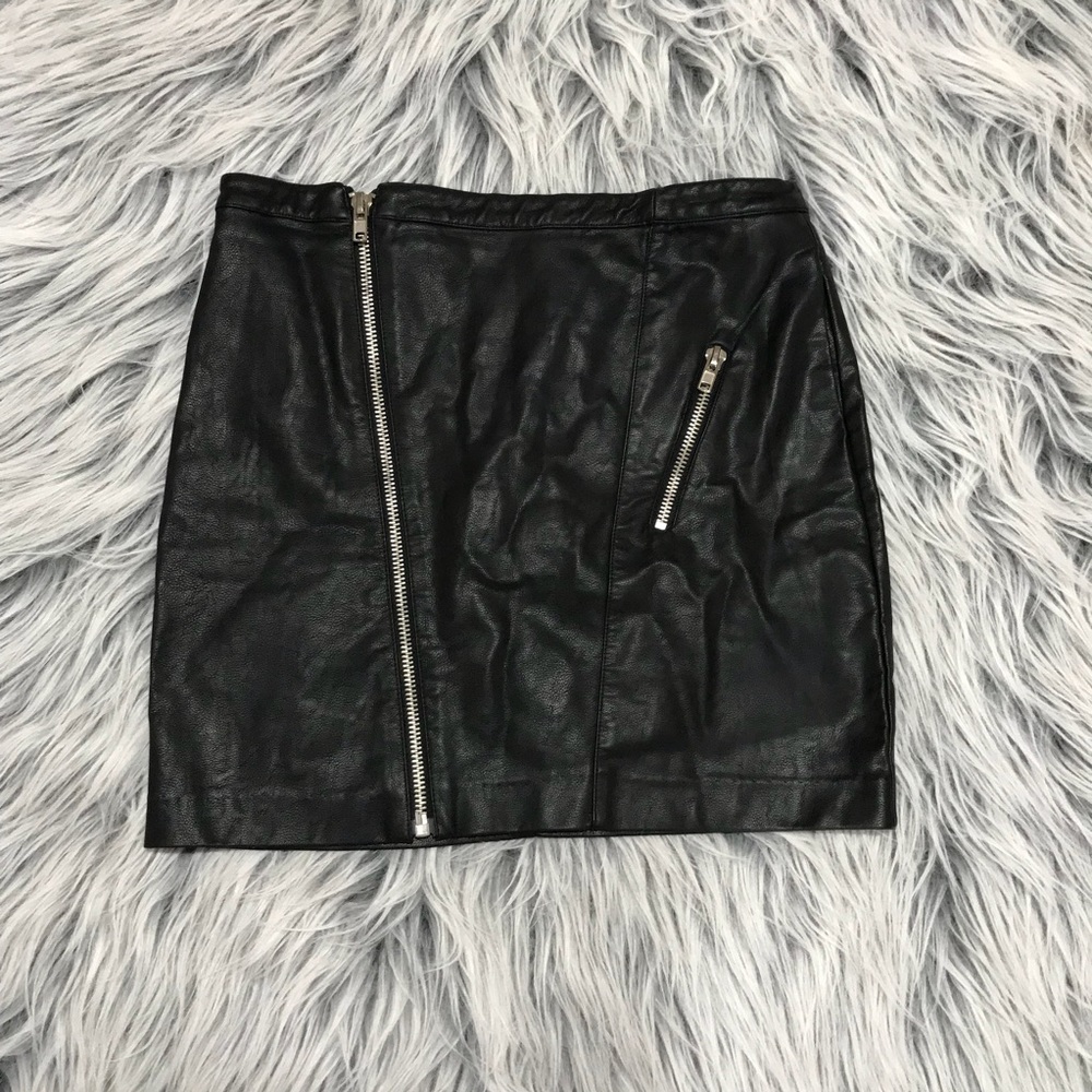 Black faux leather mini skirt with zipper detail .
