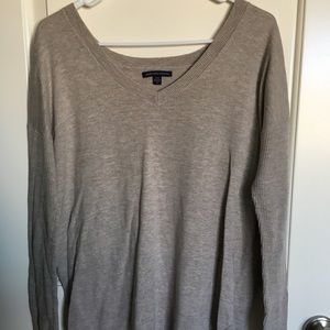 Long-sleeved, oatmeal sweater.