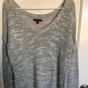 Long sleeved, grey marled sweater.