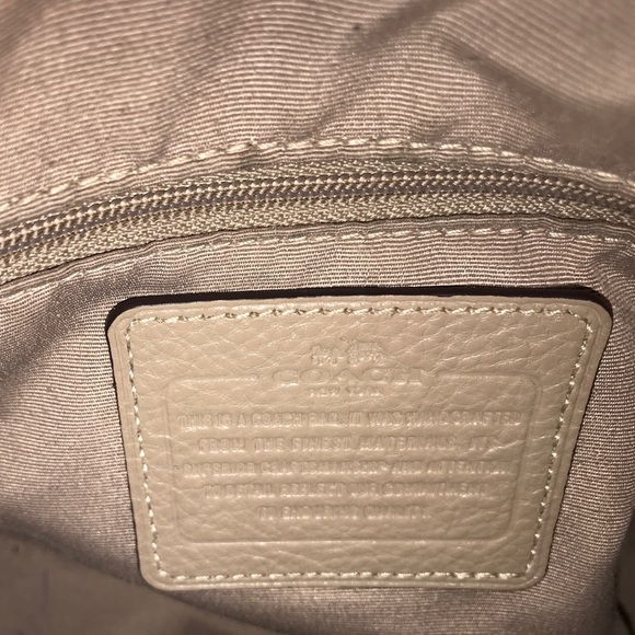 Beige and gold coach purse