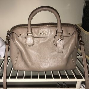 Beige and gold coach purse