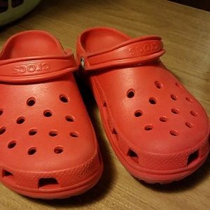 Red pair of crocs
