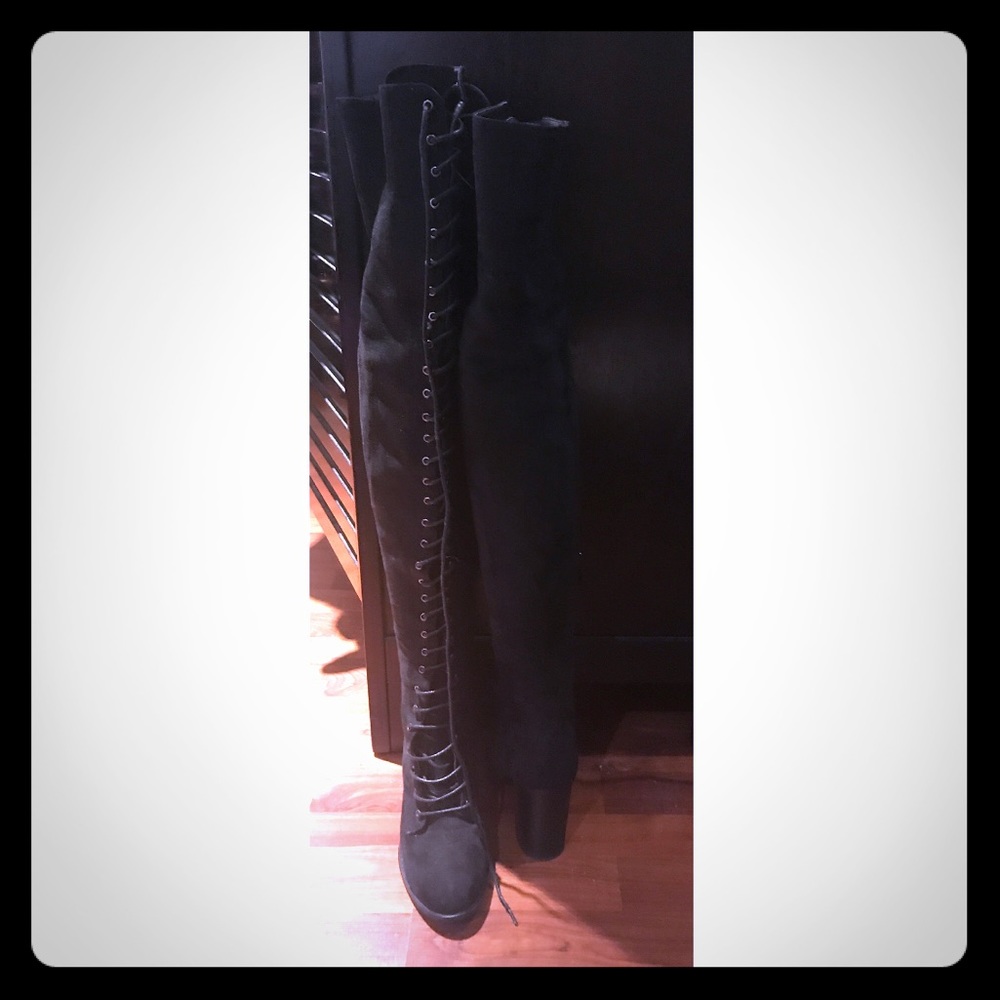 Lace up thigh high boots.