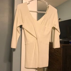 Cream colored crisscross 3 quarter sleeve top