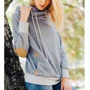 Cowl neck hoodie with suede patchwork. BOUTIQUE