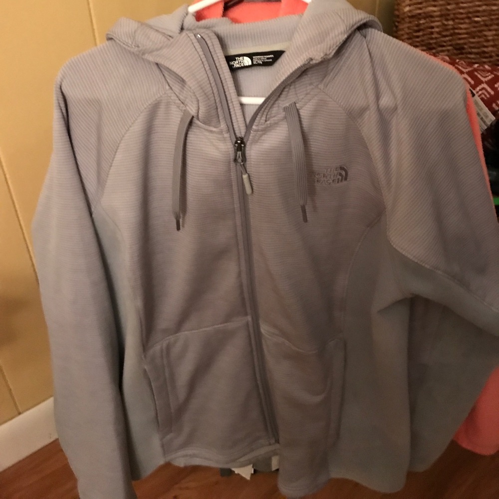 Women's thin hooded polyester North face zip coat.
