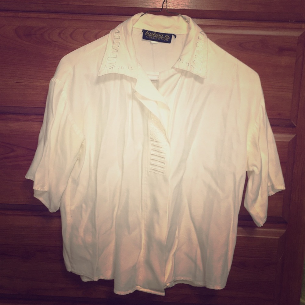 Short sleeved light cream colored blouse