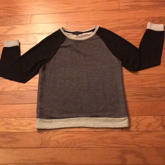 black sweater with sheer sleeves