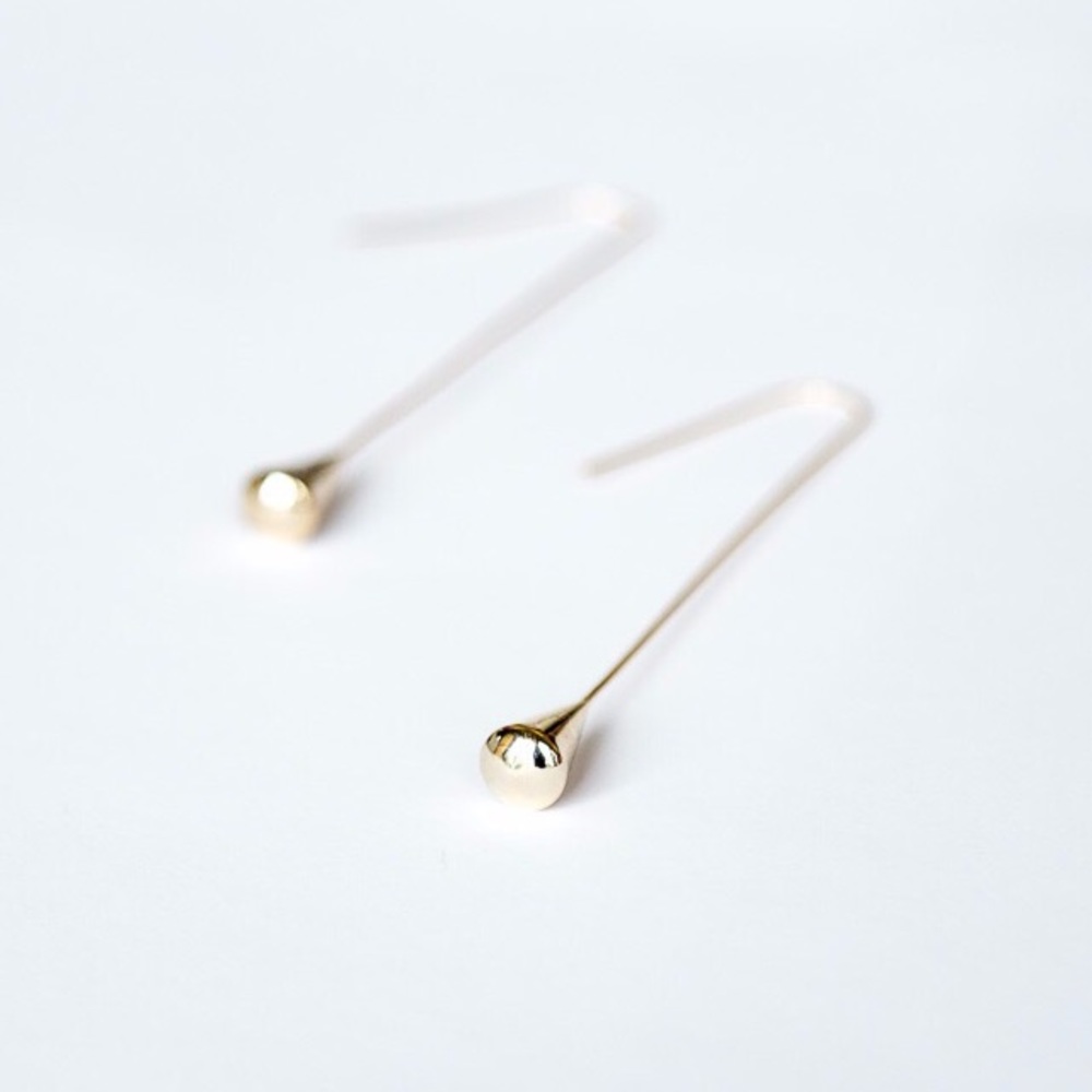 Gold tear drop statement earrings