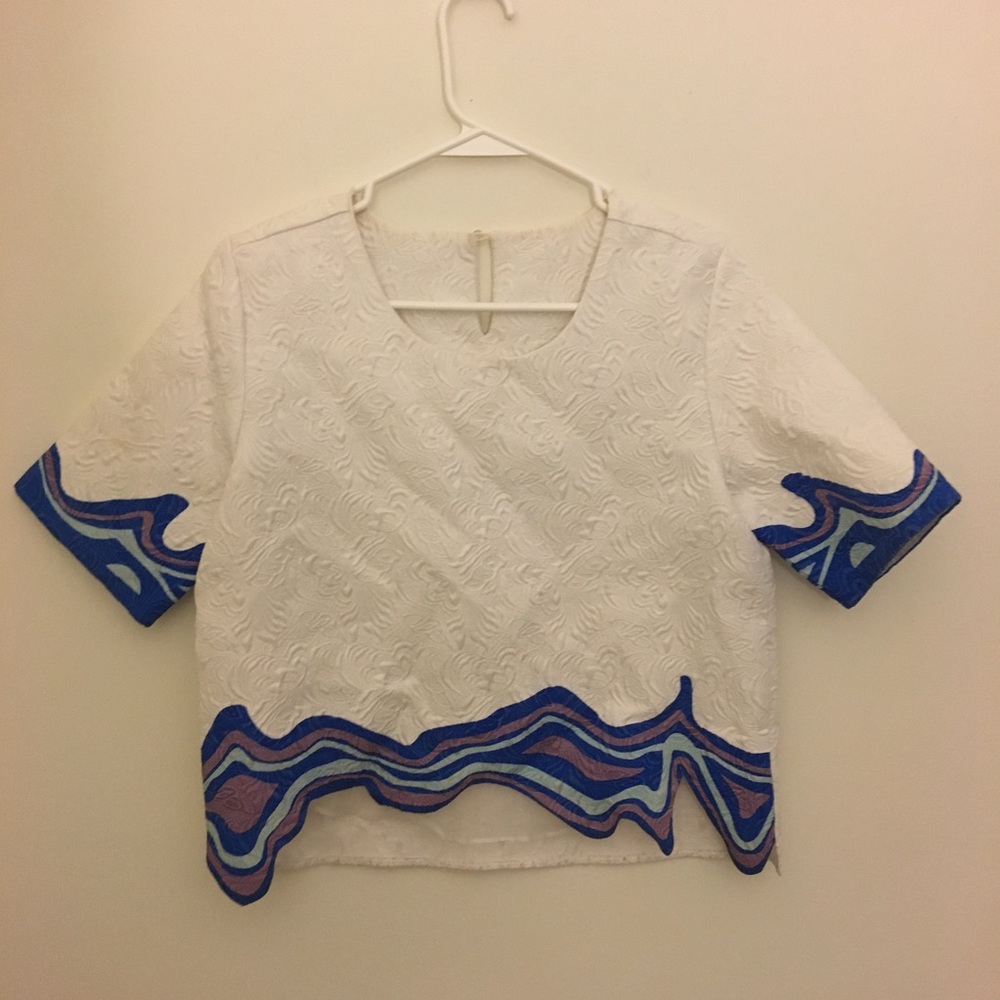 White top with blue detail