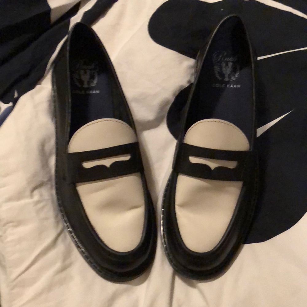 Black and white Cole Haan Pinch penny loafers