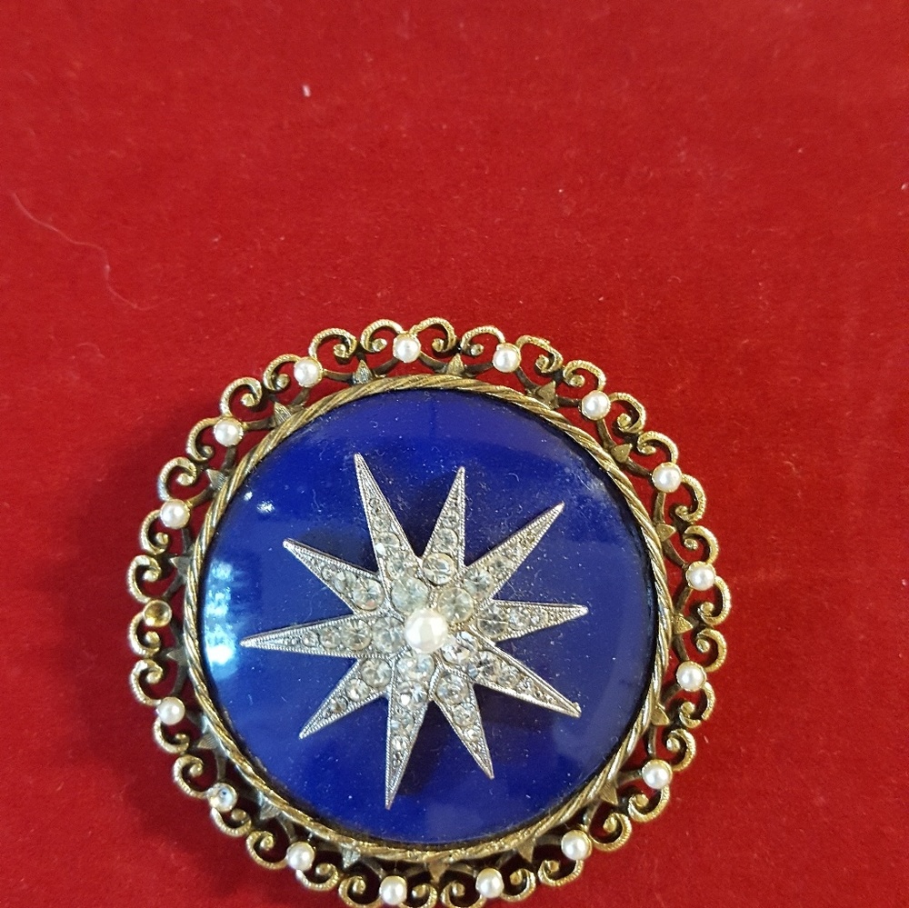 Vintage blue enamel star pin with potato pearls.