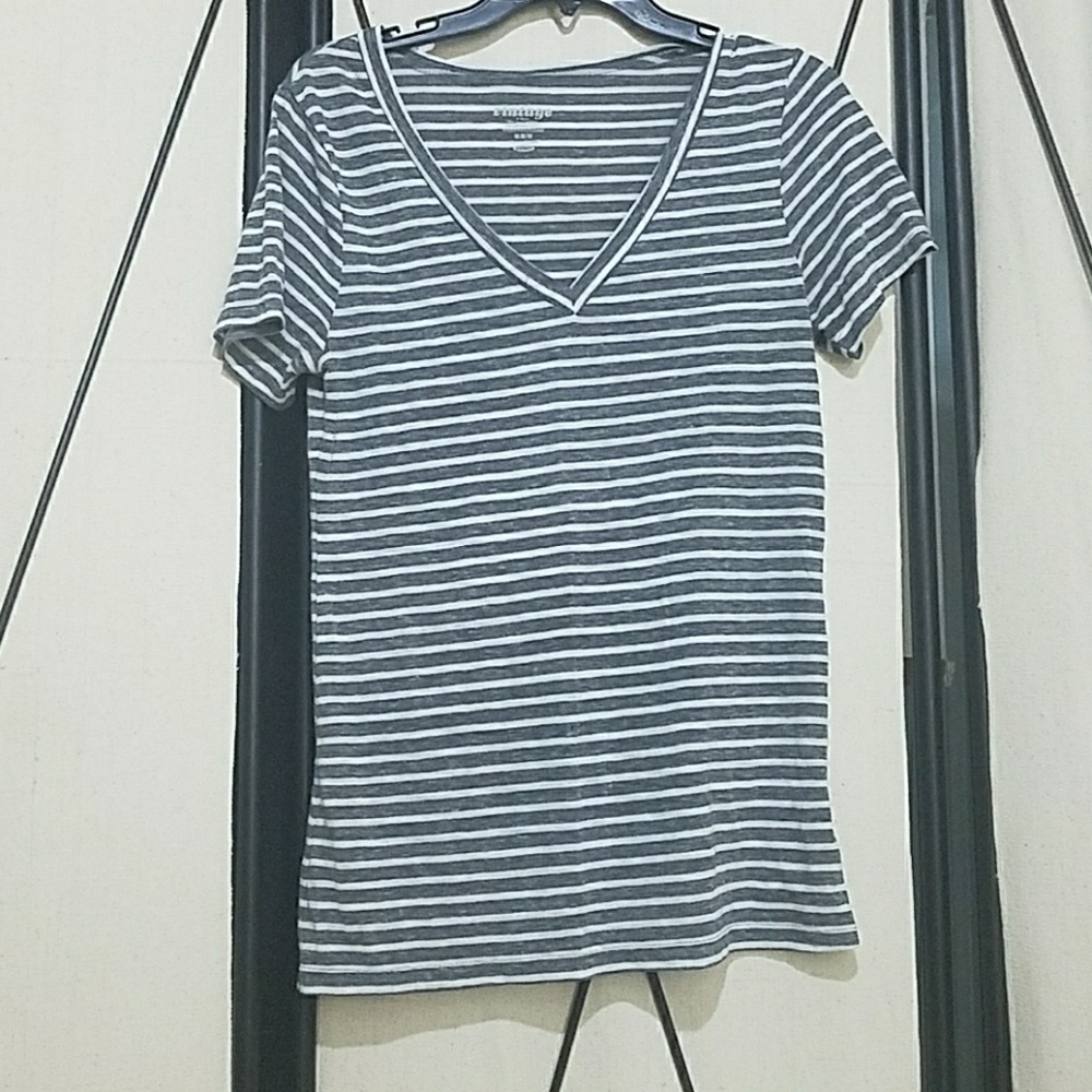 V neck gray and white striped t-shirt.