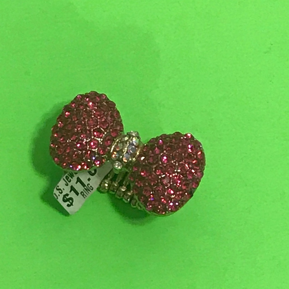 Bow tie pink stone encrusted ring