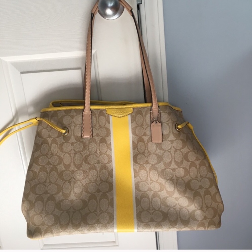 Yellow and tan coach bag
