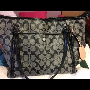 Black and gray coach purse