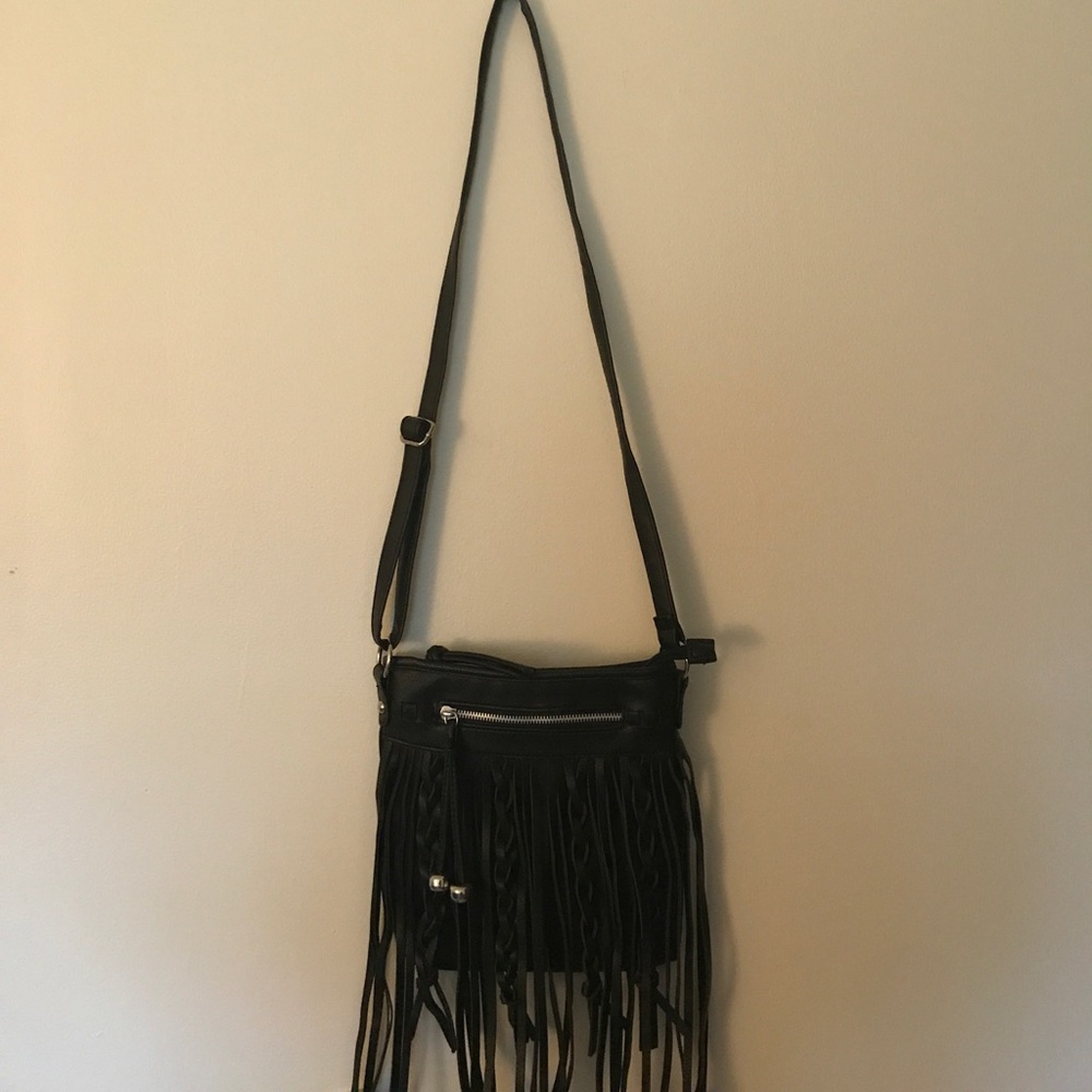 Crossbody bag with fringe and braided detail!