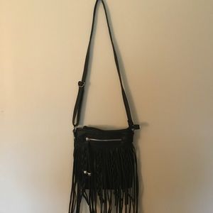 Crossbody bag with fringe and braided detail!