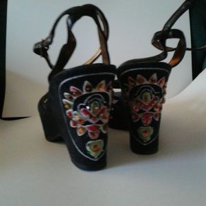 Sexy black wedges with decorative heels.