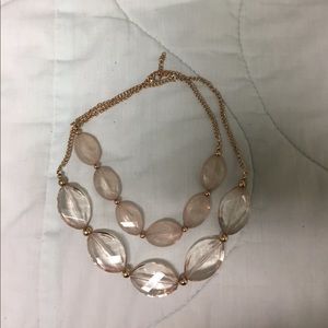 Blush colored necklace with gold chain